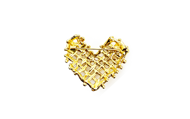 Broche in goudkleur met vlechtwerk, achterkant met speld