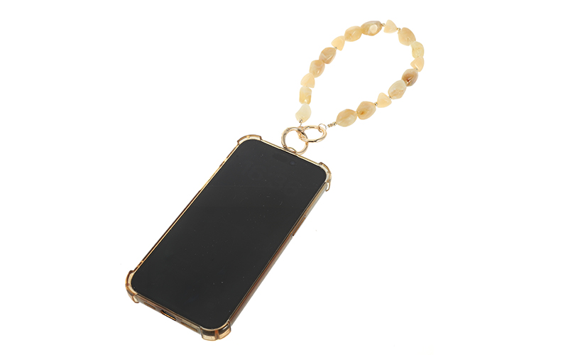 Telefoonbandje Nellie in khaki, aan een telefoon bevestigd